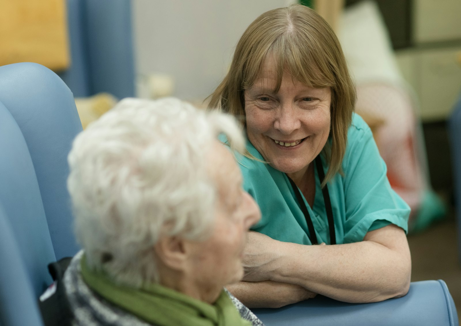 Support worker sharing a warm moment with a client at home